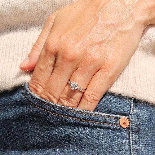 fig 1. An Art Deco platinum engagement ring set with a round old European cut diamond and accent diamonds along the shoulders.