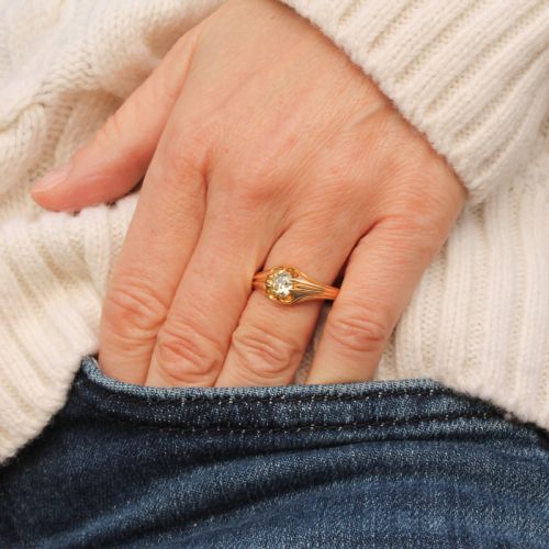fig 1. A late Victorian yellow gold ring featuring a single central antique cut fancy yellow diamond in a carved setting.