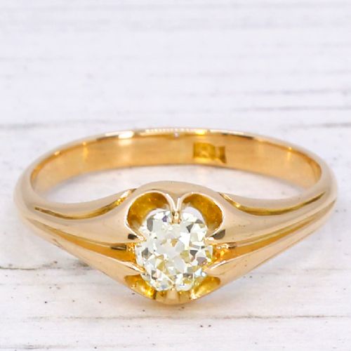 fig 2. A late Victorian yellow gold ring featuring a single central antique cut fancy yellow diamond in a carved setting.