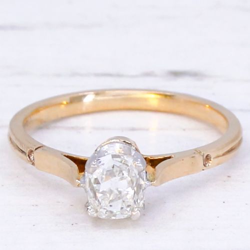 fig 2. An antique yellow gold solitaire ring featuring a central old cut diamond in a platinum claw setting.