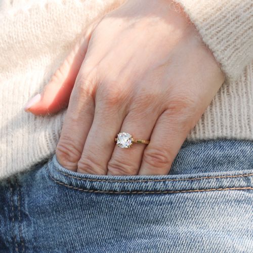 fig 1. An antique yellow gold solitaire ring featuring a cushion-shaped old cut diamond in a claw setting.