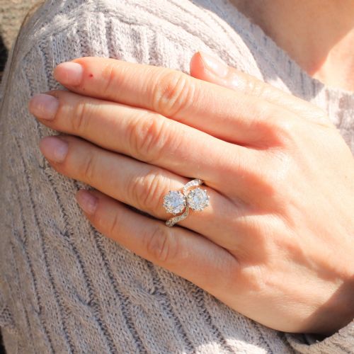 fig 1. A vintage two-stone diamond Toi et Moi ring featuring two old European cut diamonds set in claw settings with a yellow gold band and diamond-paved shoulders.
