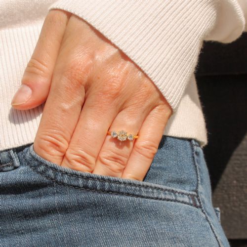 fig 1. An Edwardian yellow gold trilogy ring featuring three old-cut diamonds set in claw mountings.