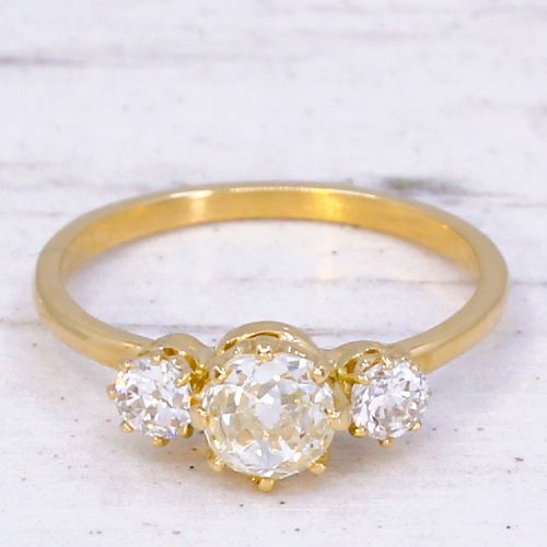 fig 2. An Edwardian yellow gold trilogy ring featuring three old-cut diamonds set in claw mountings.