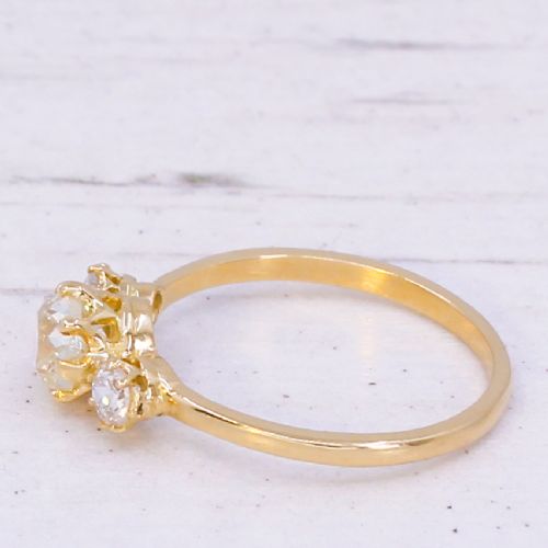 fig 3. An Edwardian yellow gold trilogy ring featuring three old-cut diamonds set in claw mountings.