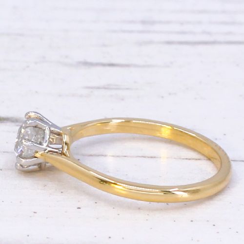 A 1920s engagement ring featuring a single old cut diamond held in a six-claw white metal setting on a slender yellow gold band. View IV