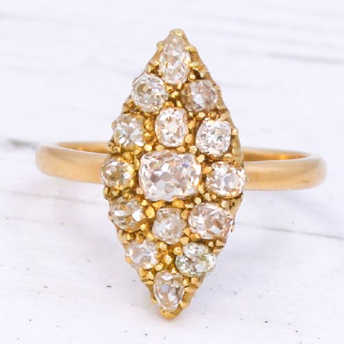 fig 2. A Victorian yellow gold ring featuring a pointed marquise-shaped cluster set with multiple old-cut diamonds.
