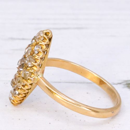 fig 3. A Victorian yellow gold ring featuring a pointed marquise-shaped cluster set with multiple old-cut diamonds.