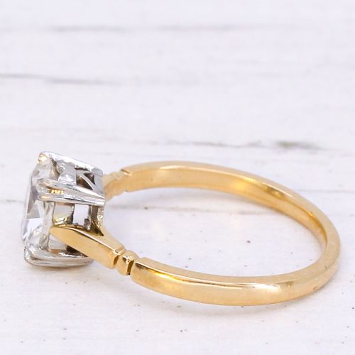 An antique gold engagement ring featuring an old mine cut solitaire diamond held in a claw setting. View IV
