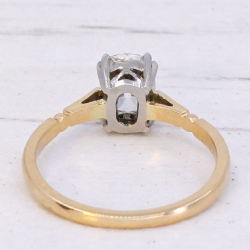 An antique gold engagement ring featuring an old mine cut solitaire diamond held in a claw setting. View V