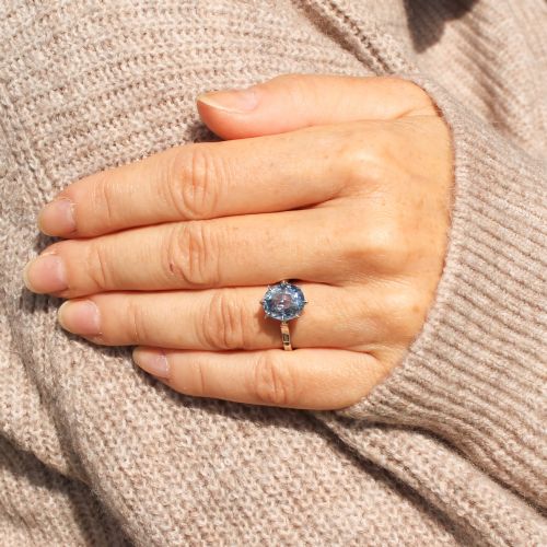 fig 1. An Art Deco platinum solitaire ring featuring a large oval-cut light blue sapphire held in an eight-claw setting.