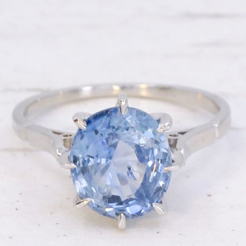 fig 2. An Art Deco platinum solitaire ring featuring a large oval-cut light blue sapphire held in an eight-claw setting.