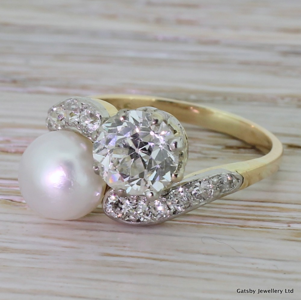 
Art Deco Natural Pearl & 1.36 Carat Old Cut Diamond Crossover Ring, circa 1920
