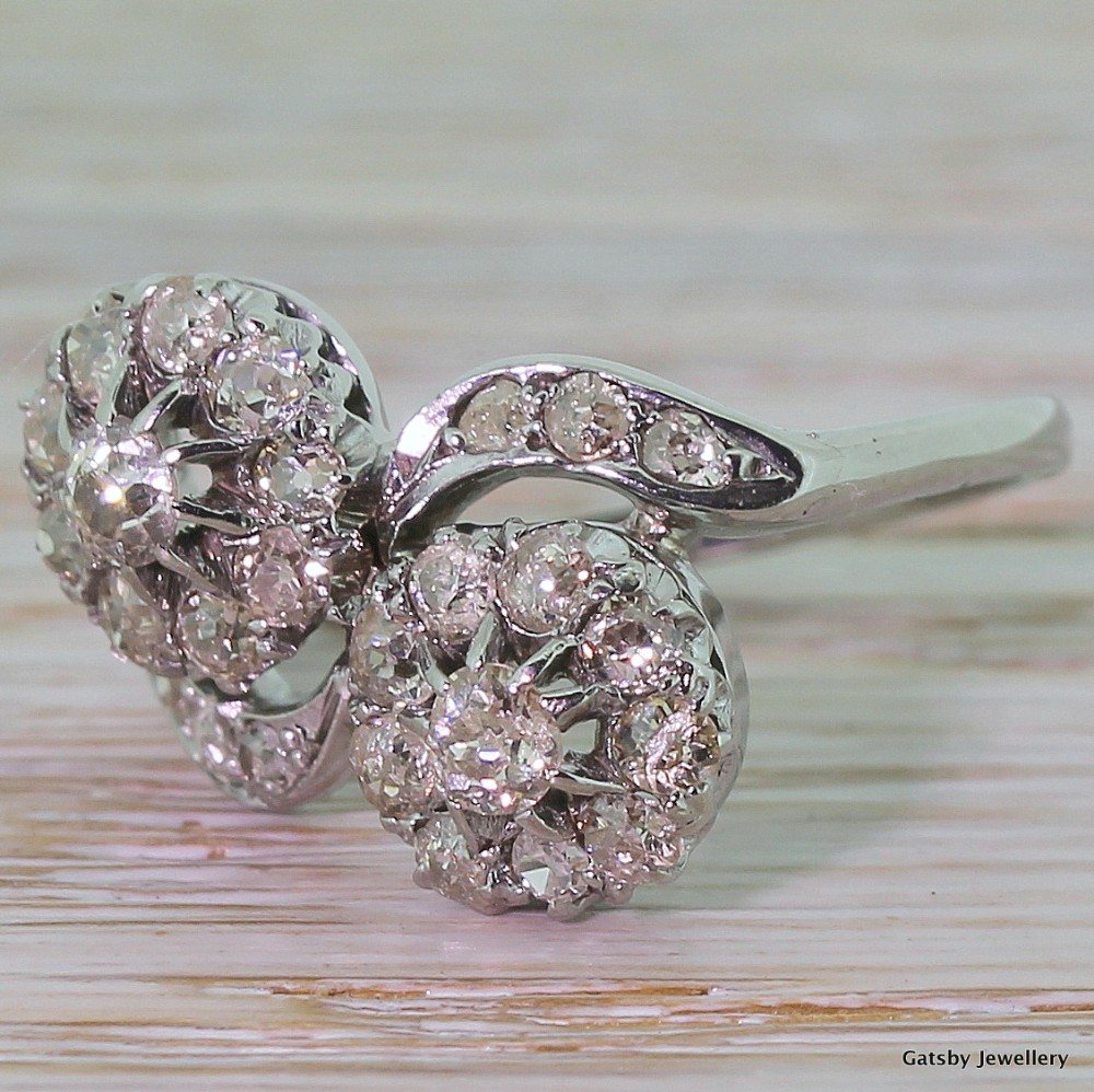 Mid-Century 1.50 Carat Old Mine Cut Double Daisy Twist Ring, circa 1940
