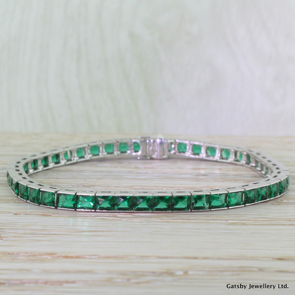 Art Deco 6.90 Carat French Cut Emerald Line Bracelet, Platinum, circa 1930
