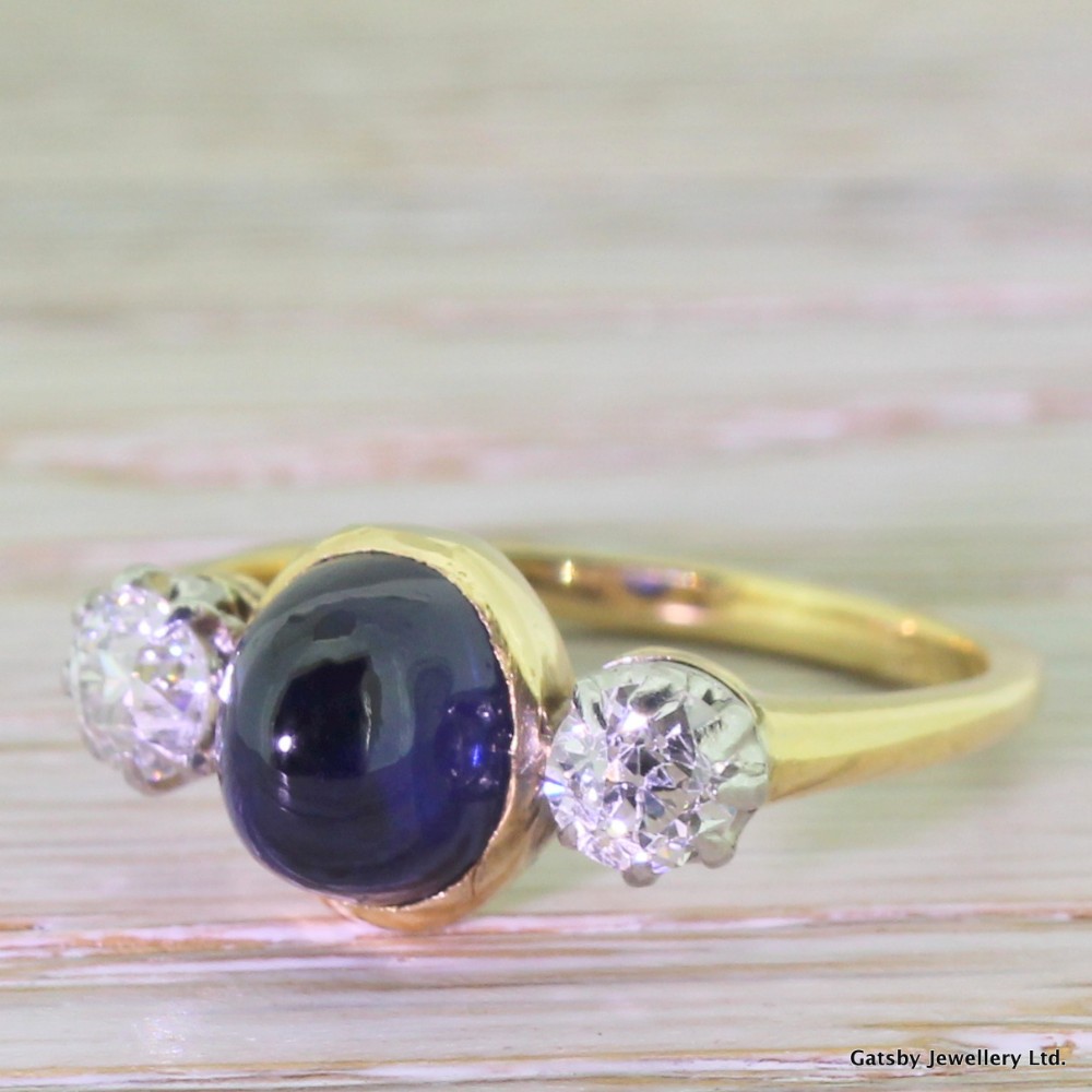 Art Deco 2.00 Carat Cabochon Sapphire & 0.70 Carat Old Cut Diamond Trilogy Ring, circa 1920
