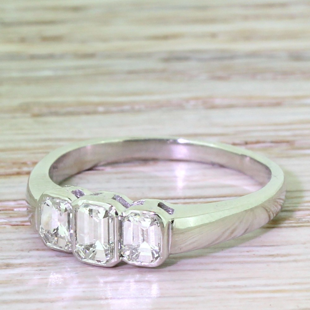 Retro 0.75 Carat Emerald Cut Diamond Trilogy Ring, circa 1950
