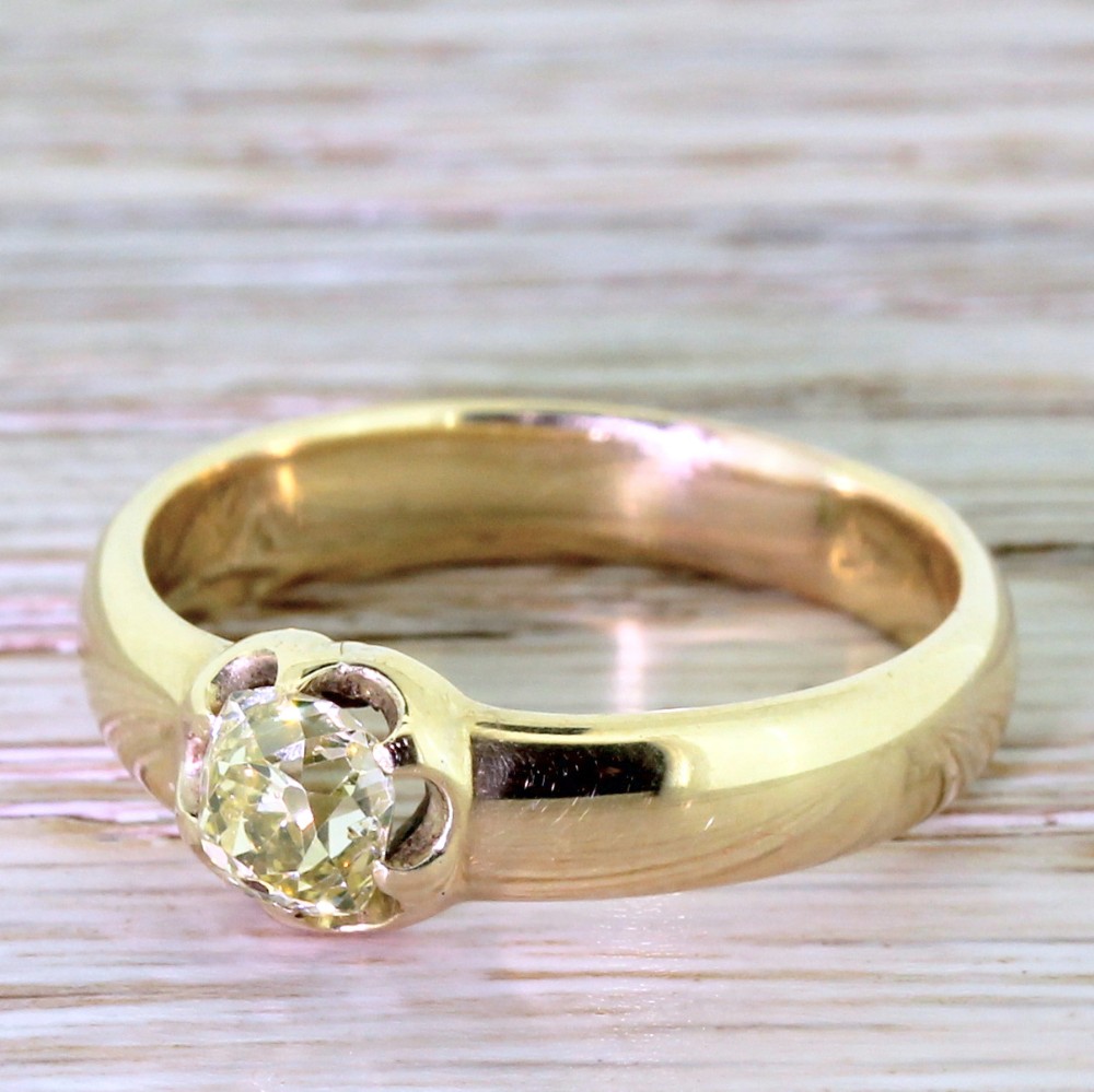 Victorian 0.75 Carat Fancy Light Yellow Old Cut Diamond Solitaire Ring, circa 1900

