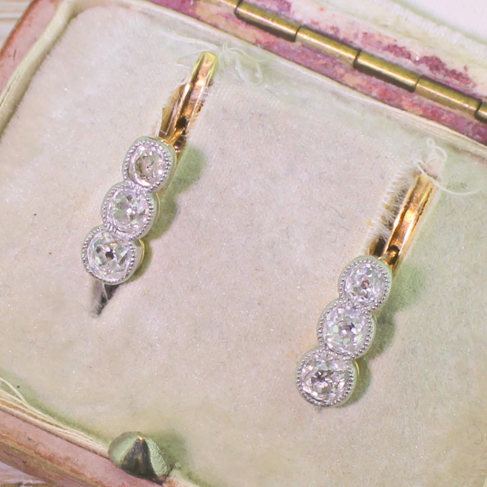 Edwardian 0.90 Carat Old Cut Diamond Three Stone Earrings, circa 1910
