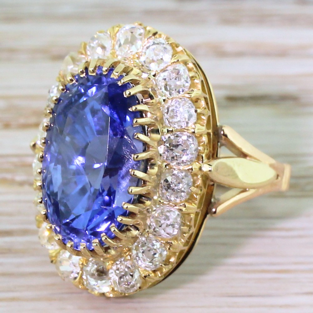Edwardian 10.44 Carat Natural Ceylon Sapphire & Old Cut Diamond Cluster Ring, circa 1905
