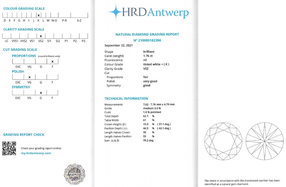 A mid-century solitaire ring featuring a central round old-cut diamond set in a multi-claw platinum mounting with carved foliate shoulder details. View VII