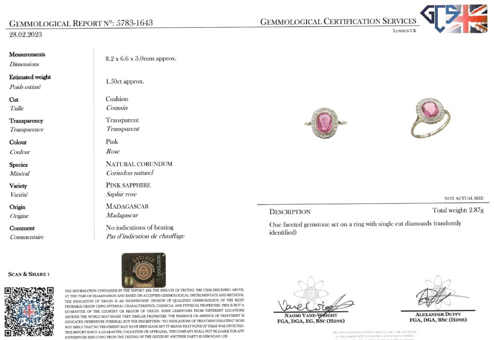 A mid-century ring featuring a central cushion-cut pink sapphire framed by a halo of small diamonds set in a white metal band with split shoulders. View VII