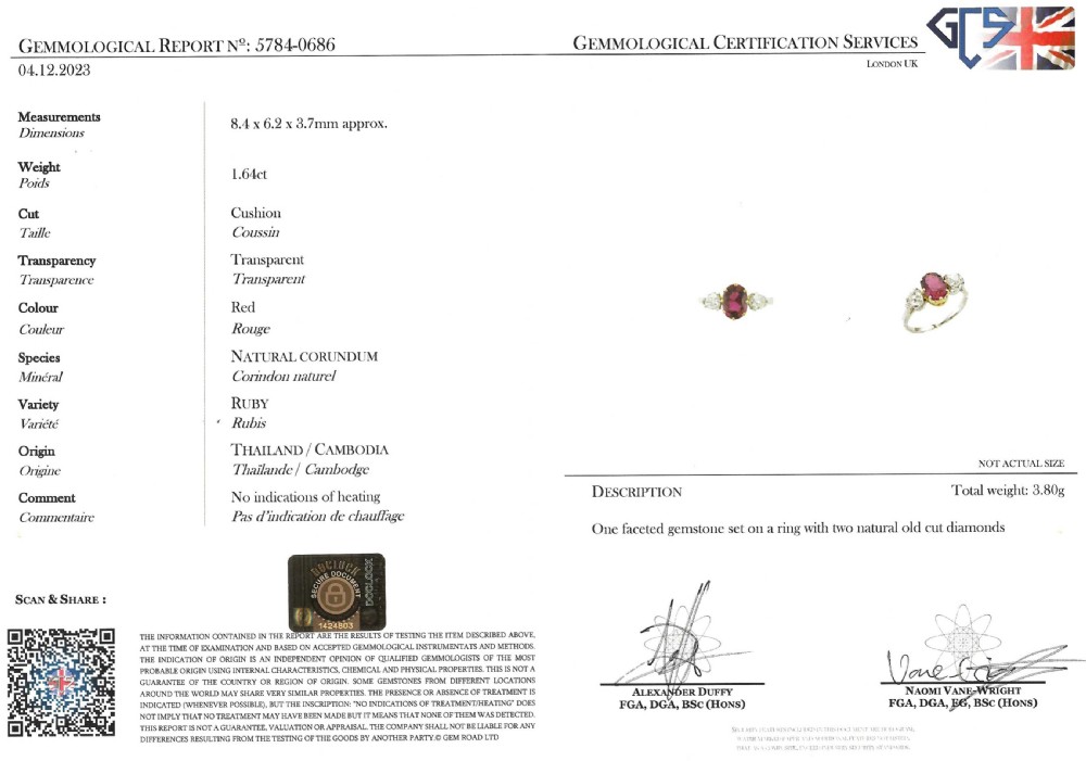 An Art Deco three-stone ring featuring a central oval cut red ruby claw-set alongside two round diamonds on a silver-coloured metal band. View VII