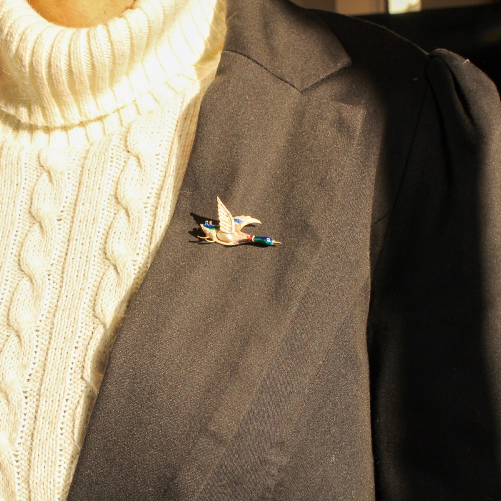 A late Victorian gold brooch shaped as a mallard duck in flight with colourful vitreous enamel and a pearl body. View II