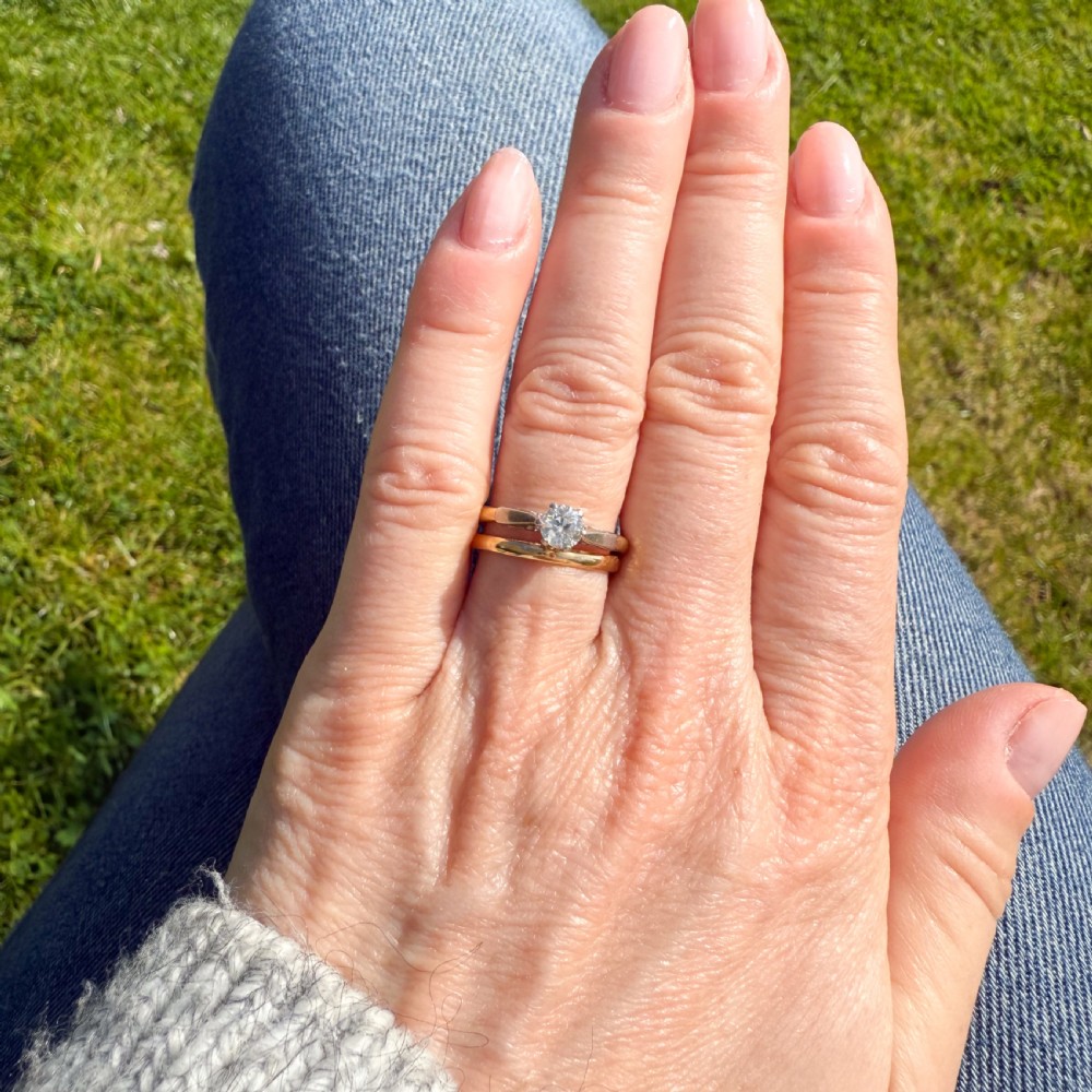 A mid-century engagement ring featuring a single old-cut diamond set in platinum shoulders on a yellow gold band. View VIII