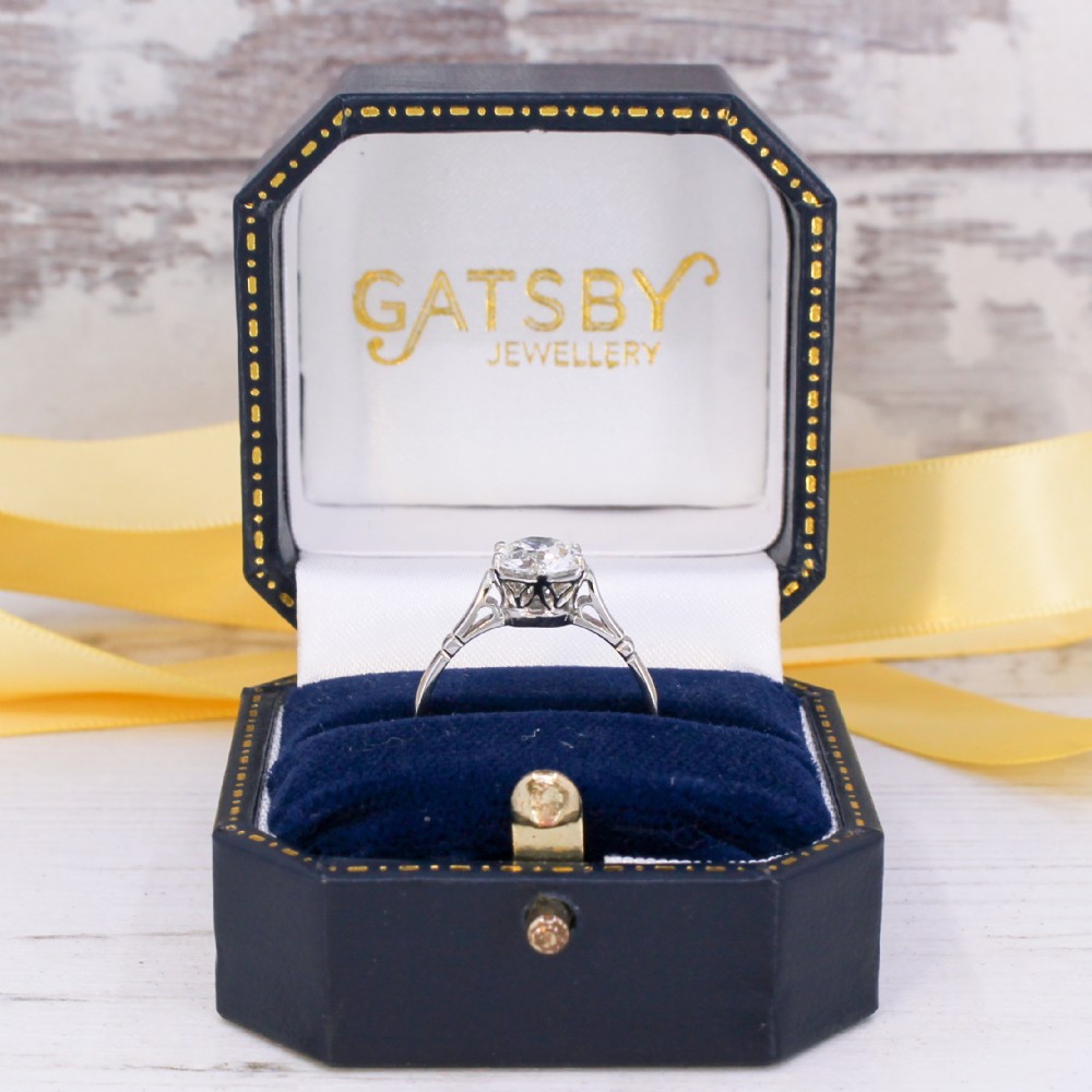 An antique platinum solitaire ring set with a single round old-cut diamond in a six-claw setting. View VIII