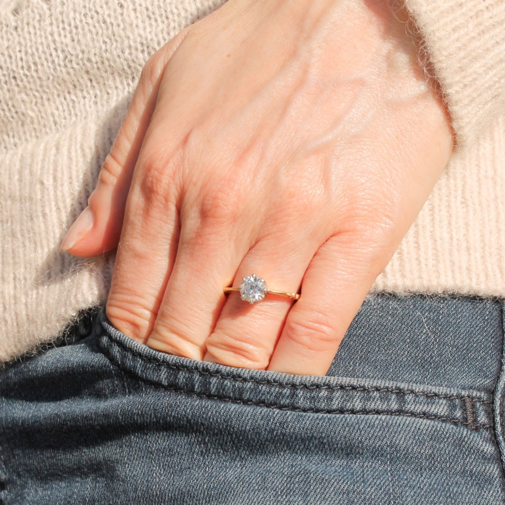 A vintage yellow gold engagement ring featuring a central old cut diamond set in a six-claw platinum head with stepped shoulders. View II
