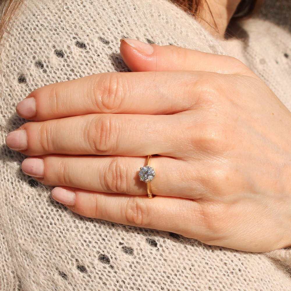 A vintage yellow gold engagement ring featuring a central old cut diamond set in a six-claw platinum head with stepped shoulders. View VII