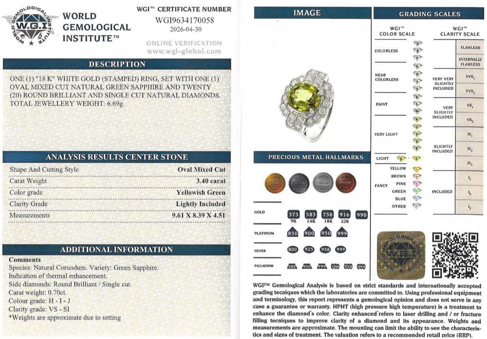 A vintage white precious metal ring featuring a central oval green sapphire encircled by a halo of round diamonds and diamond-set shoulders. View VIII