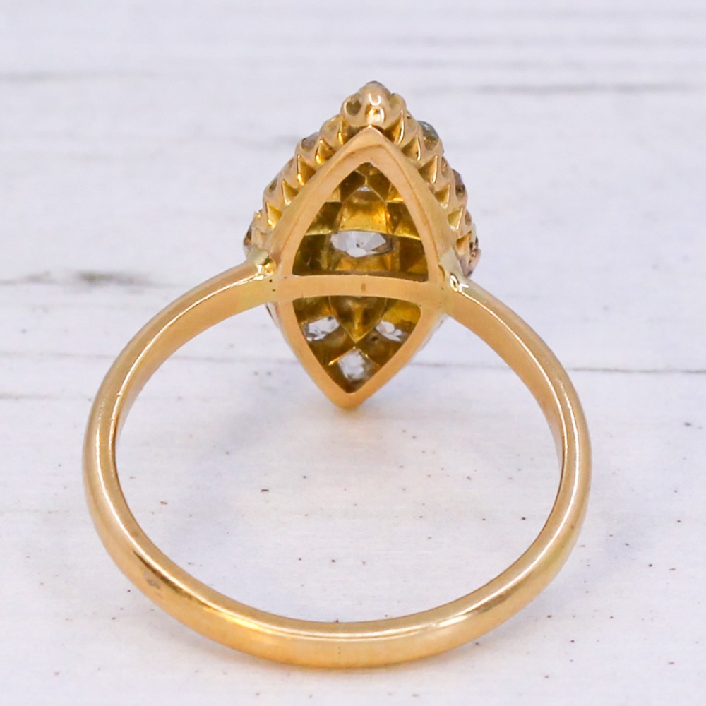 A Victorian yellow gold ring featuring a pointed marquise-shaped cluster set with multiple old-cut diamonds. View V