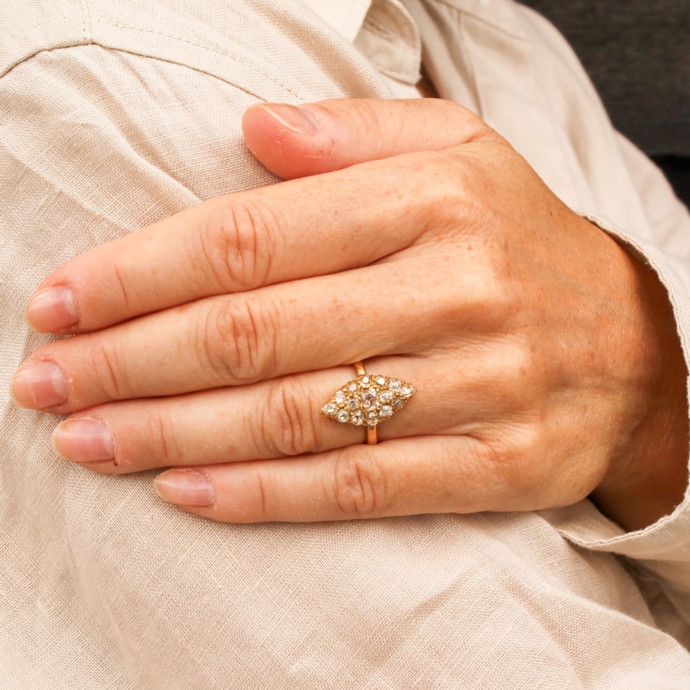 A Victorian yellow gold ring featuring a pointed marquise-shaped cluster set with multiple old-cut diamonds. View VI