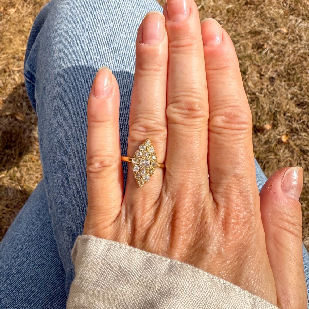 A Victorian yellow gold ring featuring a pointed marquise-shaped cluster set with multiple old-cut diamonds. View VII