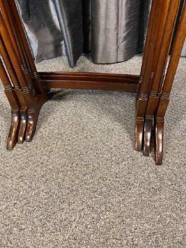 A set of three graduated mahogany nesting tables featuring light wood inlay borders on the rectangular tops and slender turned legs. View V