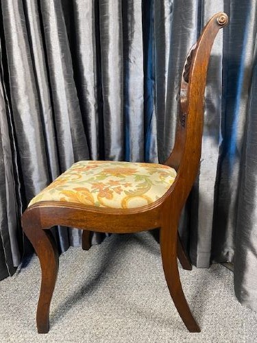 A set of six carved mahogany dining chairs featuring openwork backrests and floral patterned upholstered seats. View II
