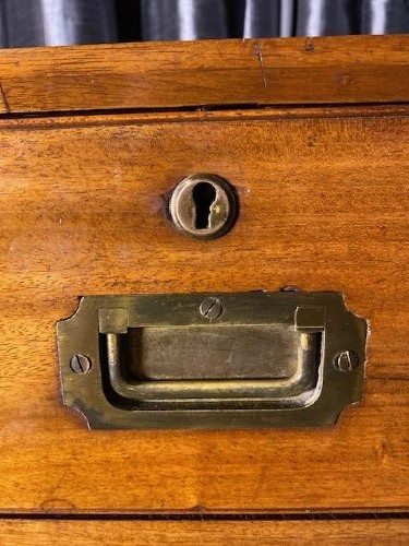 A nineteenth-century mahogany military campaign chest of drawers featuring flush brass handles, protective corner mounts, and turned feet. View III