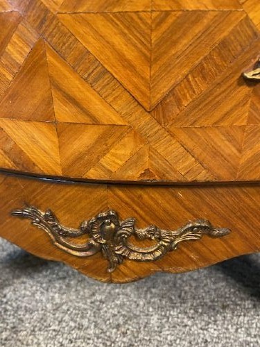 A French Louis XV style serpentine chest of drawers featuring a marble top, parquetry veneer, three drawers with brass handles, and gilt corner mounts. View III