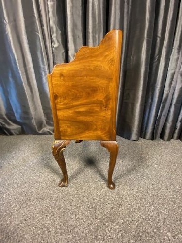 A matching pair of burr walnut bedside cabinets featuring gallery tops, twin doors, and carved cabriole legs ending in claw and ball feet. View VI
