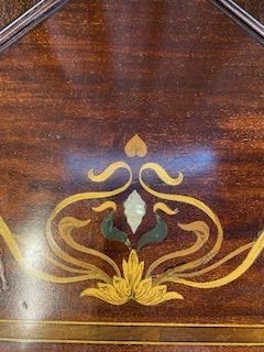 An Edwardian mahogany envelope card table featuring floral marquetry inlay on four folding flaps, a single drawer with brass knobs, and square tapered legs. View II