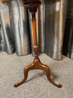 A mahogany tripod wine table featuring a dished circular top, a turned central pedestal column, and three splayed cabriole legs. View III