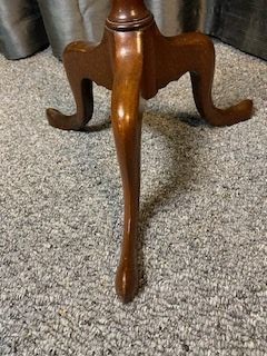 A mahogany tripod wine table featuring a dished circular top, a turned central pedestal column, and three splayed cabriole legs. View IV