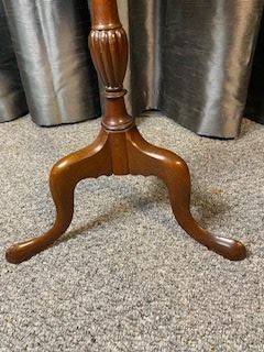A mahogany tripod wine table featuring a dished circular top, a turned central pedestal column, and three splayed cabriole legs. View V