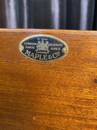 A matching pair of burr walnut bedside cabinets featuring shaped galleried shelf tops, shell carvings, double cupboard doors, and cabriole legs. View IX