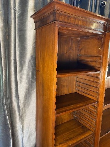 A large Victorian mahogany open breakfront bookcase featuring three sectioned shelving units over a low plinth cabinet base. View II