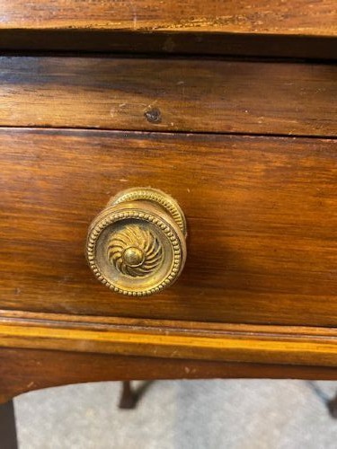 An Edwardian mahogany envelope card table featuring marquetry floral inlay on four triangular folding top leaves, a single drawer with brass handles, and square tapered legs. View VII