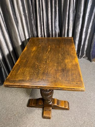 A dark oak draw-leaf dining table featuring extended side leaves, heavy carved bulbous legs, and a sturdy central stretcher. View II