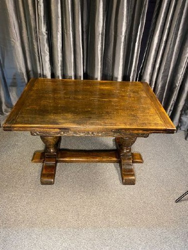 A dark oak draw-leaf dining table featuring extended side leaves, heavy carved bulbous legs, and a sturdy central stretcher. View III
